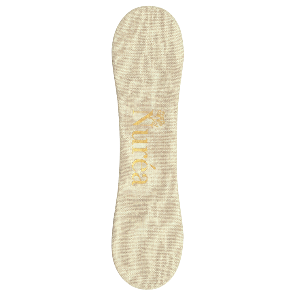 The Nurture Clip in Oat, a magnetic breastfeeding reminder clip for keeping track of which side you nursed from